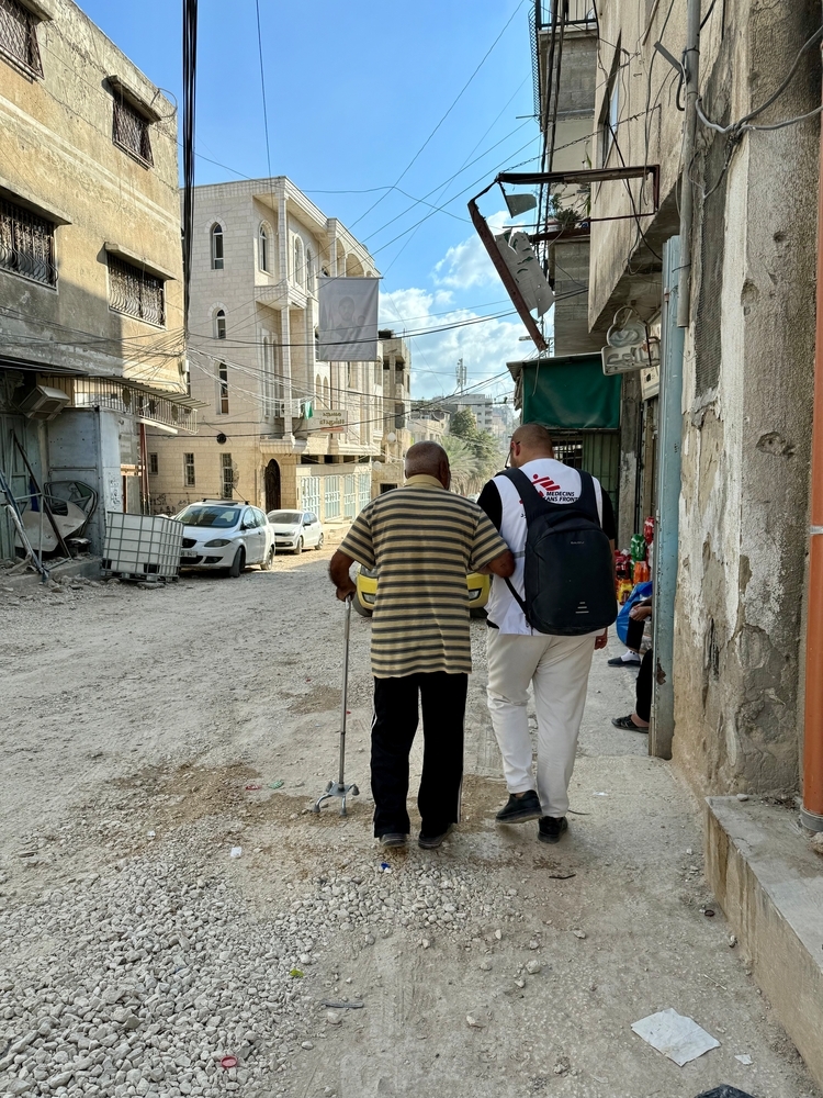 man walking through the streets