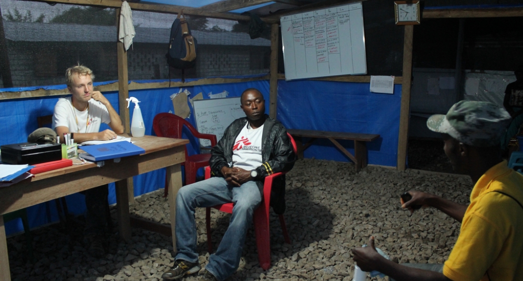 © Martin Zinggl/MSF - Jesse still working late night, doing job interviews with possible future health promoters in Liberia.